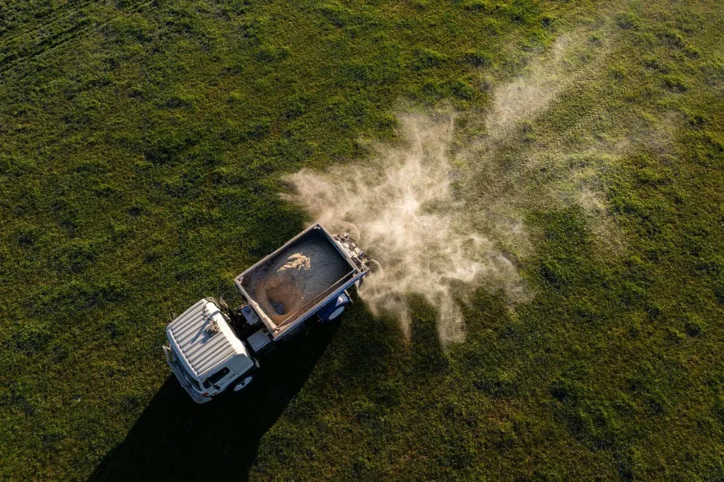 Aerial view of spreader working a paddock